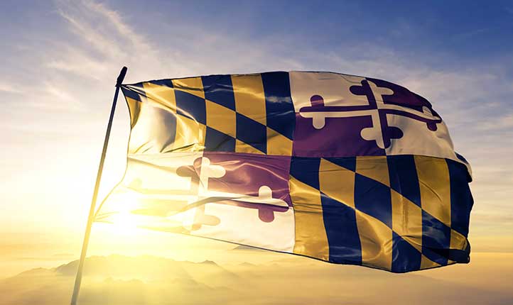 Maryland flag back lit at sunset
